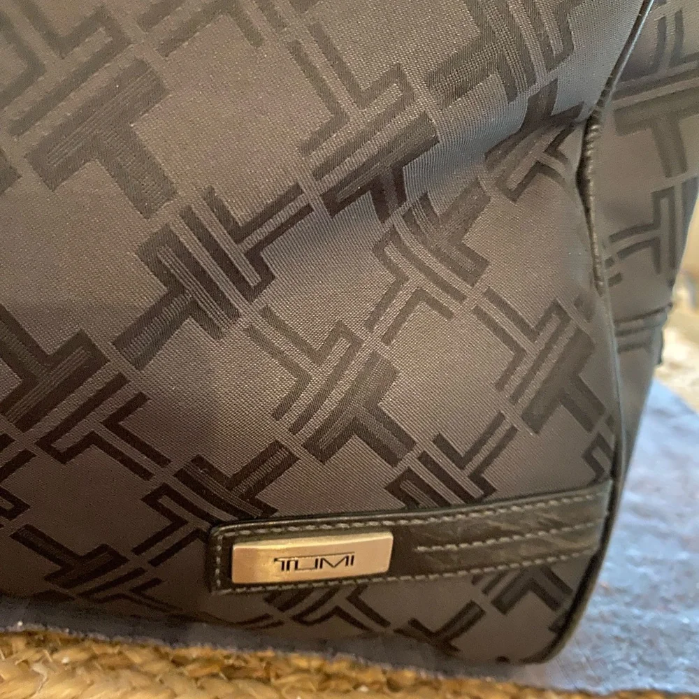 Tumi preowned definately